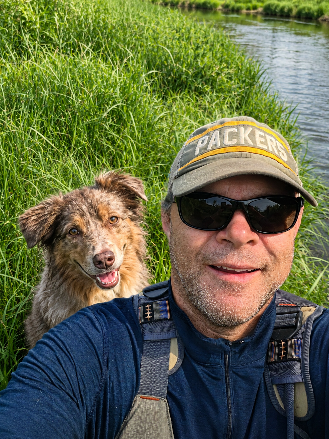 Peter, founder of ViewTech LLC, with his dog by a Wisconsin stream